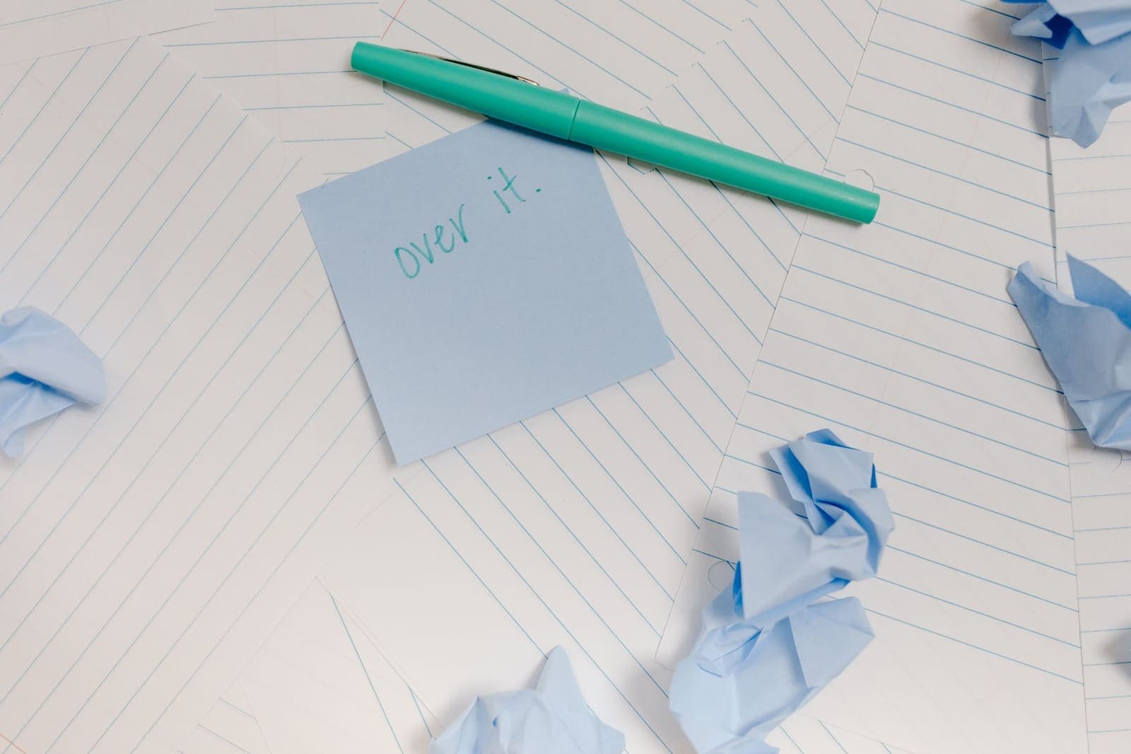 Crumpled paper to-do list on a desk, representing list overwhelm and planning failure